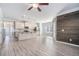 Open concept living area with wood floors and plenty of natural light and a wood accent wall at 202 Bryon Ln, Acworth, GA 30102