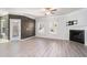 Bright living room featuring a fireplace, wood accent wall and a glass patio door at 202 Bryon Ln, Acworth, GA 30102