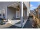 A covered patio features a ceiling fan, stylish rug and convenient walkway at 202 Bryon Ln, Acworth, GA 30102