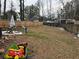 Fenced backyard with patio furniture, play equipment, and grassy yard at 2615 Leeshire Ct # 1, Tucker, GA 30084