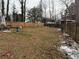 Wide backyard with a swing set, patio seating, and full wooden fence providing privacy at 2615 Leeshire Ct # 1, Tucker, GA 30084