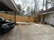 Home's backyard with a patio and wooden fence at 2615 Leeshire Ct # 1, Tucker, GA 30084