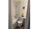 Bathroom featuring white marbled-tile shower over tub, wood-look flooring, and neutral decor at 2615 Leeshire Ct # 1, Tucker, GA 30084