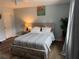 Bedroom with queen bed and wood-look floors at 2615 Leeshire Ct # 1, Tucker, GA 30084