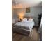 Bedroom featuring wood-look flooring, rustic nightstand, and comfortable bed at 2615 Leeshire Ct # 1, Tucker, GA 30084