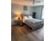 Charming bedroom with hardwood floors, neutral decor, and a comfortable bed at 2615 Leeshire Ct # 1, Tucker, GA 30084