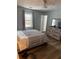 Bedroom with queen bed and wood-look floors at 2615 Leeshire Ct # 1, Tucker, GA 30084