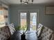 Bright dining room featuring a wooden table, six chairs, and access to the backyard at 2615 Leeshire Ct # 1, Tucker, GA 30084
