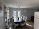 Dining room with a large table and chairs, and backyard view at 2615 Leeshire Ct # 1, Tucker, GA 30084