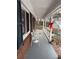 Covered porch with white railing and small table and chairs at 2615 Leeshire Ct # 1, Tucker, GA 30084