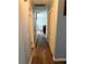 Long hallway with light walls and wood-look flooring at 2615 Leeshire Ct # 1, Tucker, GA 30084