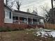 Brick ranch house with covered porch and landscaped yard at 2615 Leeshire Ct # 1, Tucker, GA 30084
