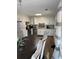 Bright kitchen features white cabinets, stainless steel appliances, and a dining area at 2615 Leeshire Ct # 1, Tucker, GA 30084