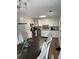 Bright kitchen features white cabinets, stainless steel appliances, and a dining area at 2615 Leeshire Ct # 1, Tucker, GA 30084