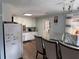 Kitchen with white cabinets and dining area view at 2615 Leeshire Ct # 1, Tucker, GA 30084