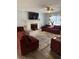 Cozy living room with fireplace, sectional sofa, and large TV at 2615 Leeshire Ct # 1, Tucker, GA 30084