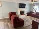 Cozy living room with fireplace, sectional sofa, and large TV at 2615 Leeshire Ct # 1, Tucker, GA 30084