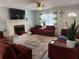 Cozy living room with fireplace, sectional sofa, and large TV at 2615 Leeshire Ct # 1, Tucker, GA 30084