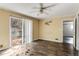 Spacious bedroom with hardwood floors and sliding glass doors leading to deck at 2828 The Meadows Way, Atlanta, GA 30349