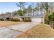 Front view of a ranch house with driveway at 2828 The Meadows Way, Atlanta, GA 30349