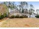 Brick ranch home with a large yard and attached garage at 2828 The Meadows Way, Atlanta, GA 30349