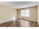 Bright living room featuring hardwood floors and large window at 2828 The Meadows Way, Atlanta, GA 30349