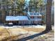 Two-story house with snow covered roof and red shutters at 804 Bankshire Dr, Suwanee, GA 30024