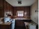 Traditional kitchen with wood cabinets, a range, and a stainless steel sink at 804 Bankshire Dr, Suwanee, GA 30024