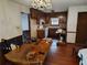 View of kitchen and dining area, with wooden cabinets and a table at 804 Bankshire Dr, Suwanee, GA 30024