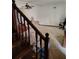 View of the living room with stairs and ceiling fan at 804 Bankshire Dr, Suwanee, GA 30024