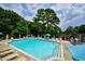 Community swimming pool with lounge chairs at 224 Triumph Nw Dr, Atlanta, GA 30327