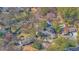 An aerial view of the property showing a private pool, mature trees, and surrounding neighborhood at 505 River Valley Rd, Sandy Springs, GA 30328