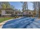 Home featuring a backyard with a pool covered for the winter at 505 River Valley Rd, Sandy Springs, GA 30328