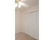 Bedroom with double door closet and ceiling fan at 1190 Ashborough Se Dr # C, Marietta, GA 30067