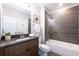 Modern bathroom with dark vanity and a large walk-in shower at 225 Blueberry Rdg, Milton, GA 30075