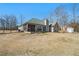 Rear view of house, highlighting the backyard and shed at 30 Graystone Dr, Covington, GA 30014