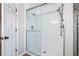 Large walk-in shower with glass enclosure and modern fixtures at 30 Graystone Dr, Covington, GA 30014