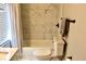Bathroom with tub, shower, toilet, and marble tile at 531 Connally St, Atlanta, GA 30312