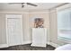 Bedroom with fireplace, double doors, and hardwood floors at 531 Connally St, Atlanta, GA 30312