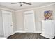 Bedroom with double doors, fireplace and hardwood floors at 531 Connally St, Atlanta, GA 30312