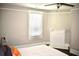 Bright bedroom with fireplace, window, and ceiling fan at 531 Connally St, Atlanta, GA 30312