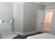 Bedroom with fireplace, door to bathroom, and hardwood floors at 531 Connally St, Atlanta, GA 30312