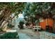 Charming brick courtyard with benches, lush greenery, and an orange building at 531 Connally St, Atlanta, GA 30312