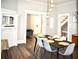 Contemporary dining area featuring a stylish chandelier and hardwood floors at 531 Connally St, Atlanta, GA 30312
