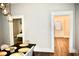 Bright dining room with table and chairs, view into adjacent bedroom and kitchen at 531 Connally St, Atlanta, GA 30312
