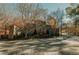 Stone entrance to a neighborhood, with decorative fountain and lush trees at 531 Connally St, Atlanta, GA 30312