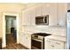 Modern kitchen with white cabinets and stainless steel appliances at 531 Connally St, Atlanta, GA 30312