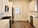Modern kitchen, white cabinets, stainless steel appliances, quartz countertops at 531 Connally St, Atlanta, GA 30312