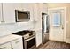 Modern kitchen, white cabinets, stainless steel appliances, quartz countertops at 531 Connally St, Atlanta, GA 30312