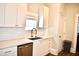 Modern kitchen with white cabinets, sink, and stainless steel dishwasher at 531 Connally St, Atlanta, GA 30312